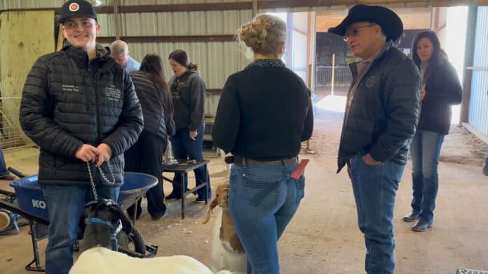 Chief Batton visiting with youth at the Choctaw Livestock Show