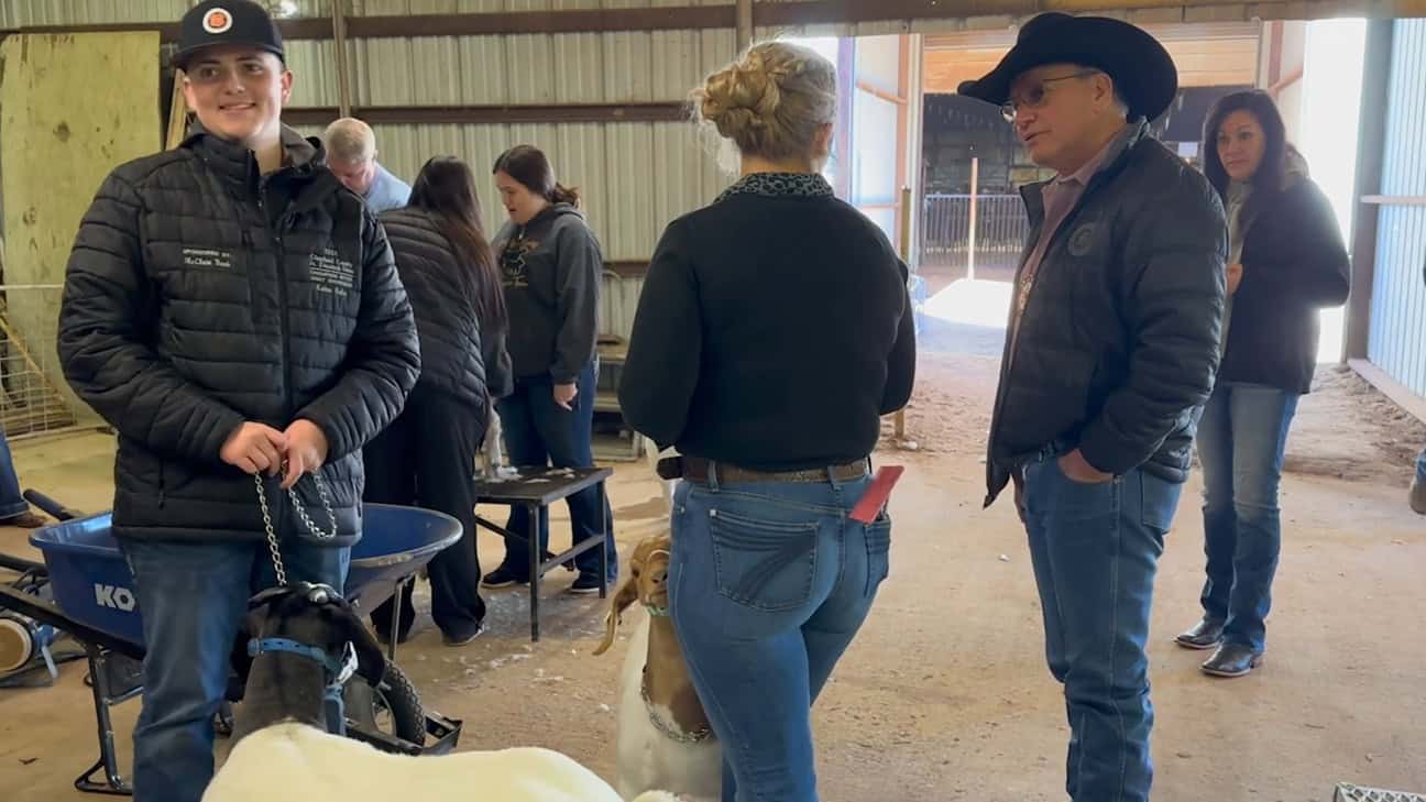 Chief Batton visiting with youth at the Choctaw Livestock Show