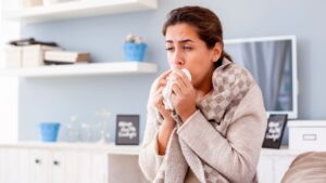 Woman coughing from the flu