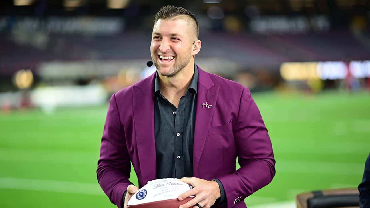 Tim Tebow holding a football