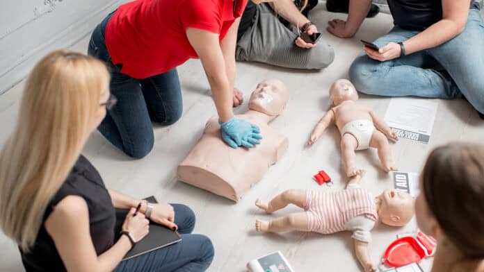 Practicing CPR on a dummy.