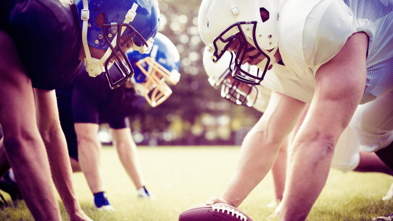 Football players on the line.