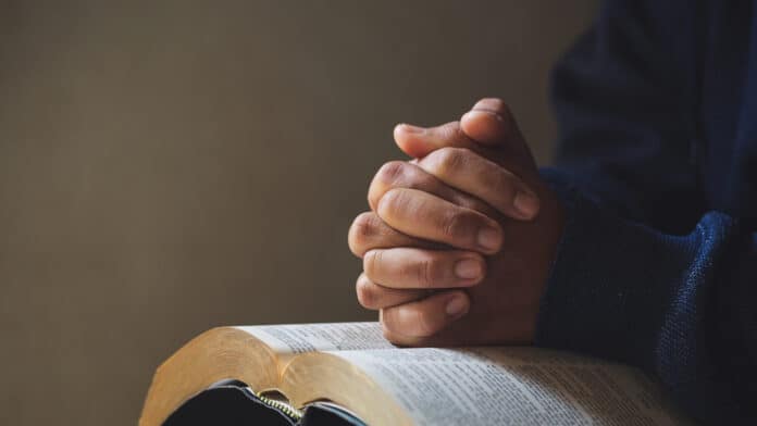 Praying over bible