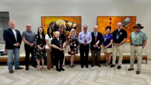 Representatives from OBI and Choctaw Nation blood drive champions pause with Chief Batton for a photo with the two awards.