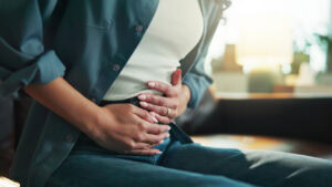 Bending over in abdominal pain