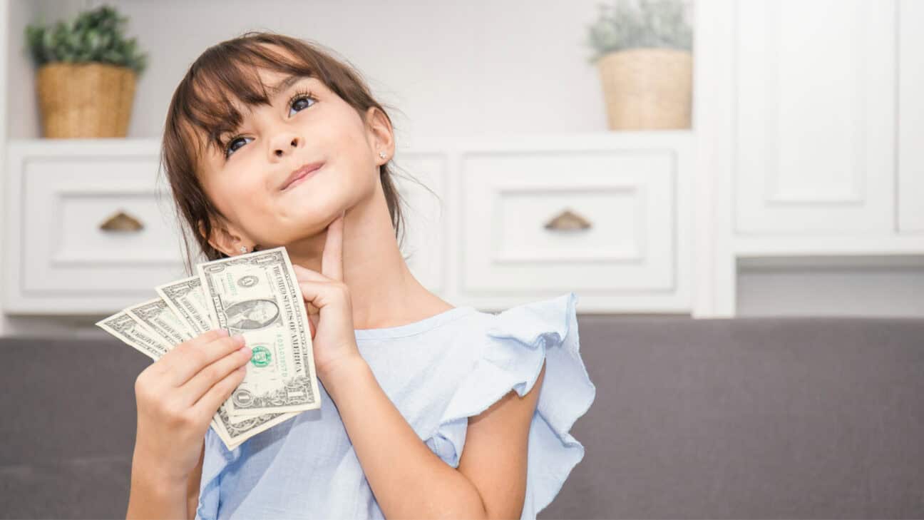 Little girl fanning money
