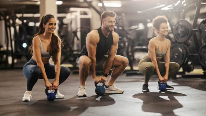 Three veterans lifting weights