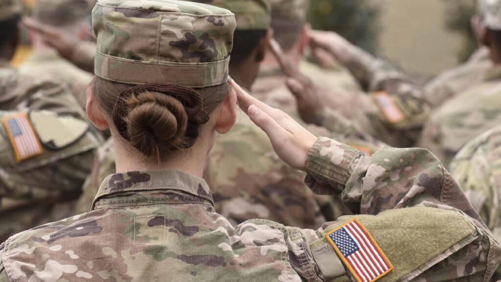 Woman veteran saluting