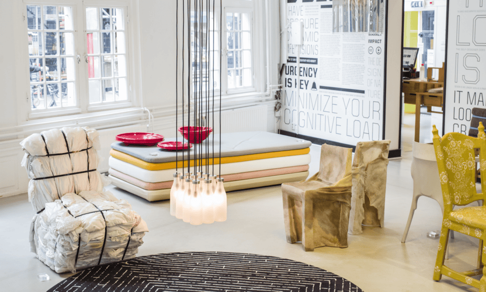 Contemporary chair and sofa in stylish room. Modern interior design.