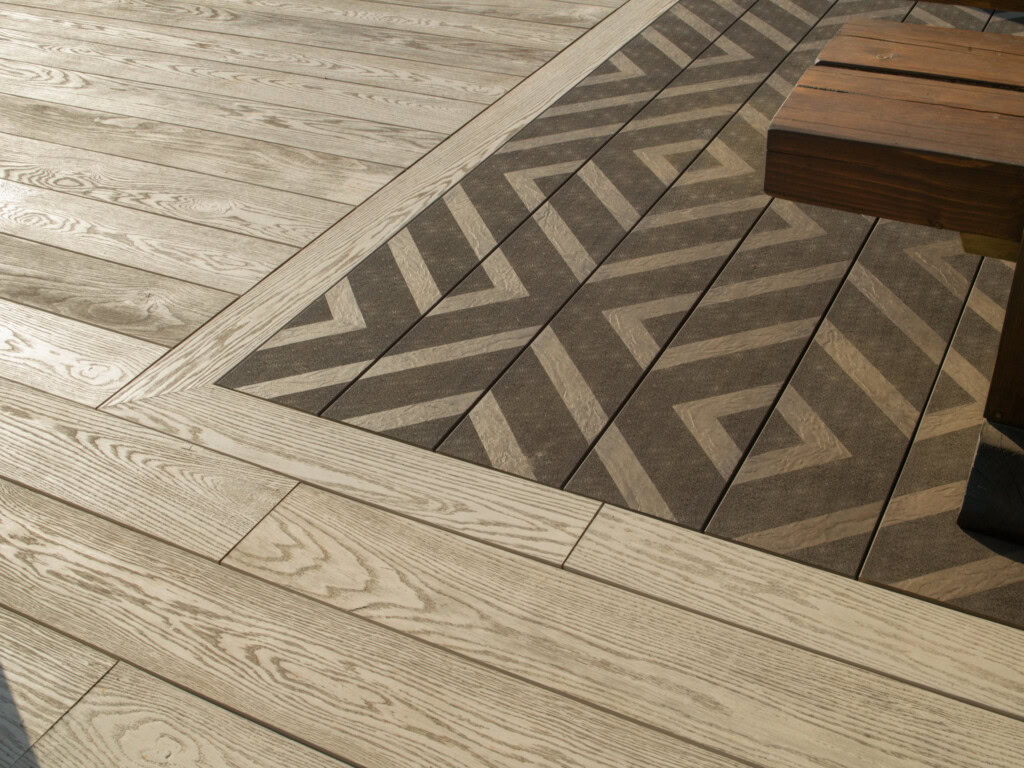 Millboard Modello Contour Limed Oak patterned decking in a garden setting