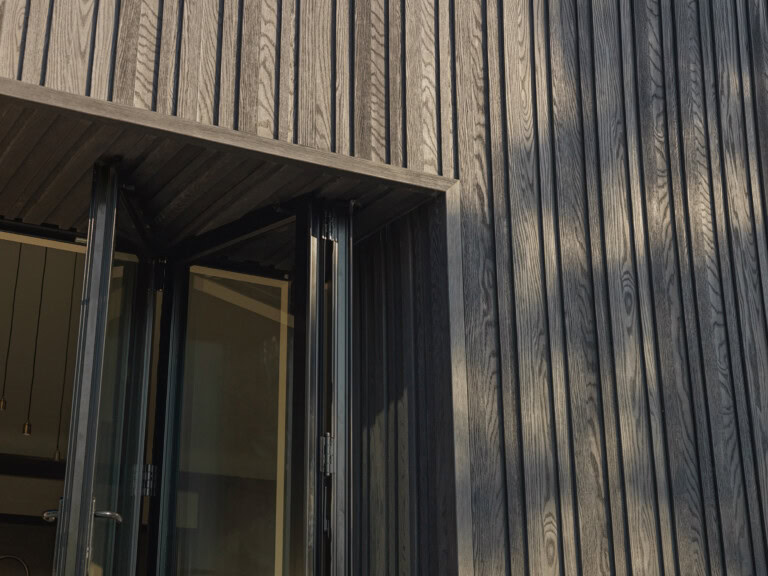Millboard Board and Batten cladding in Burnt Cedar