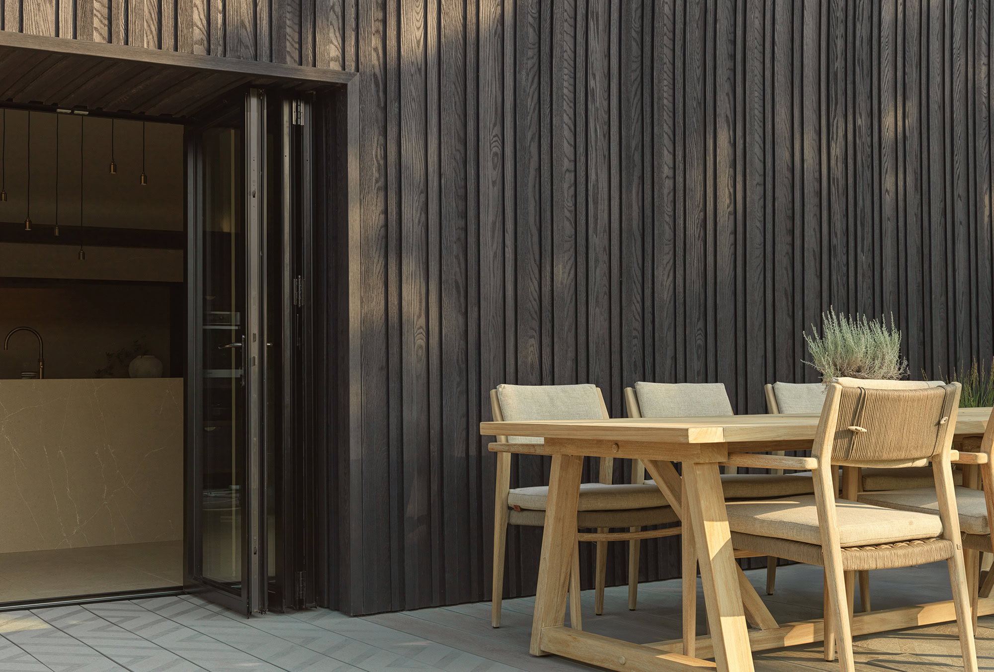 Millboard Board and Batten cladding in Burnt Cedar