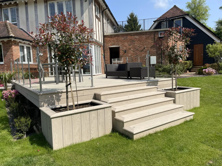 Millboard decking and dining area installed by Fairdeck in Ivy Hatch, Kent