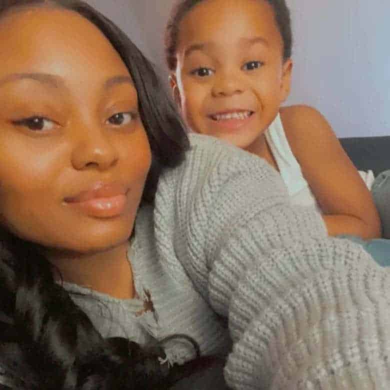 Amber posing with her son in a photo from facebook,