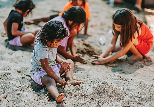 Kids play in the sand