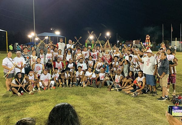Bok Chito and family and friends pose for a victory photo