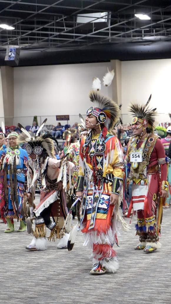 Dancers take the stage at the powwow.