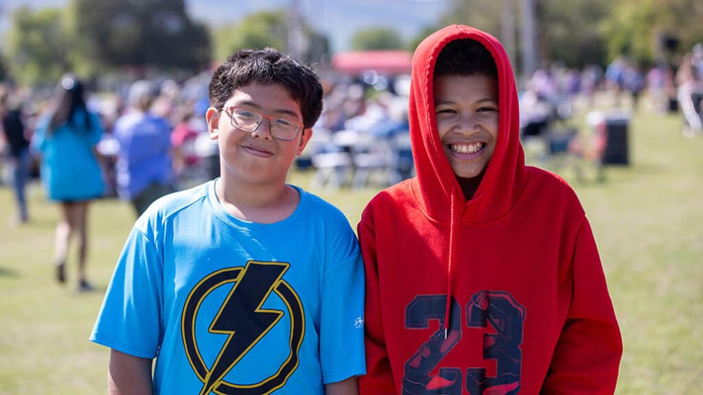 Two boys pose for a photo.