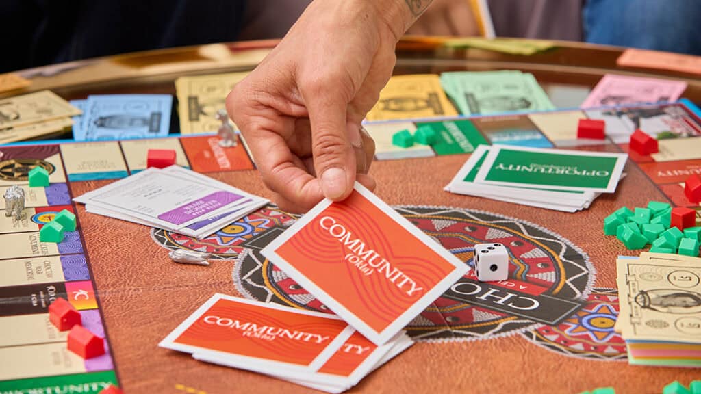 A group of people play the new Choctopoly game.
