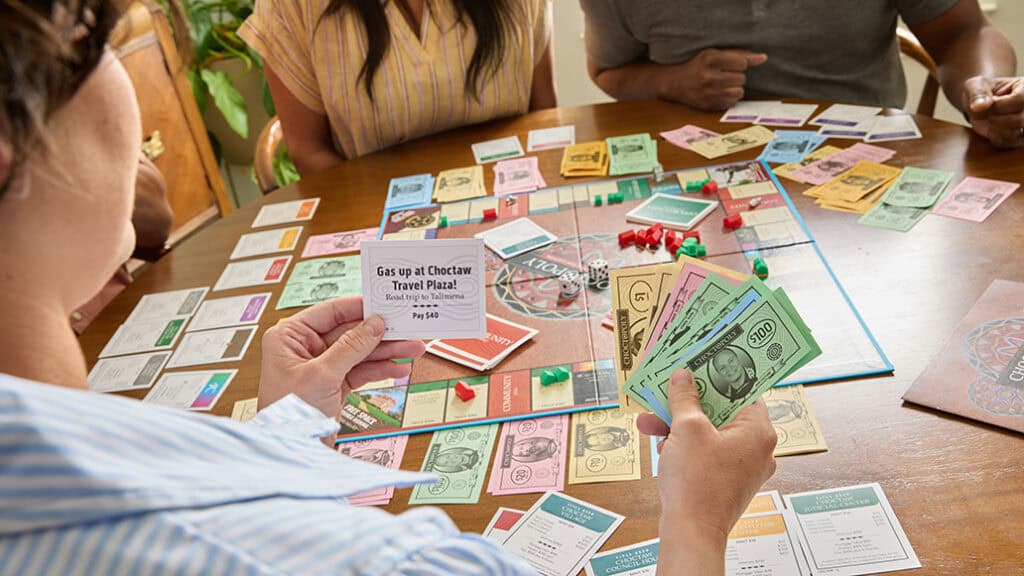 A group of people play the new Choctopoly game.