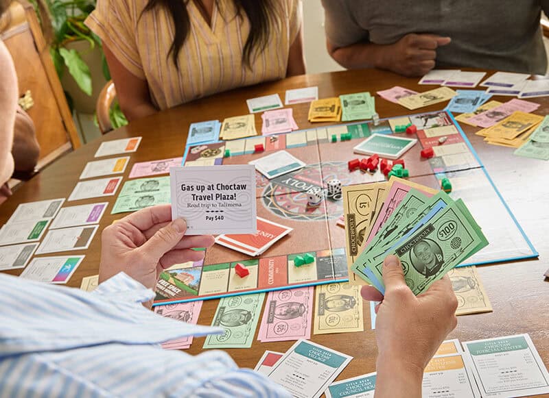 A group of people play the new Choctopoly game.