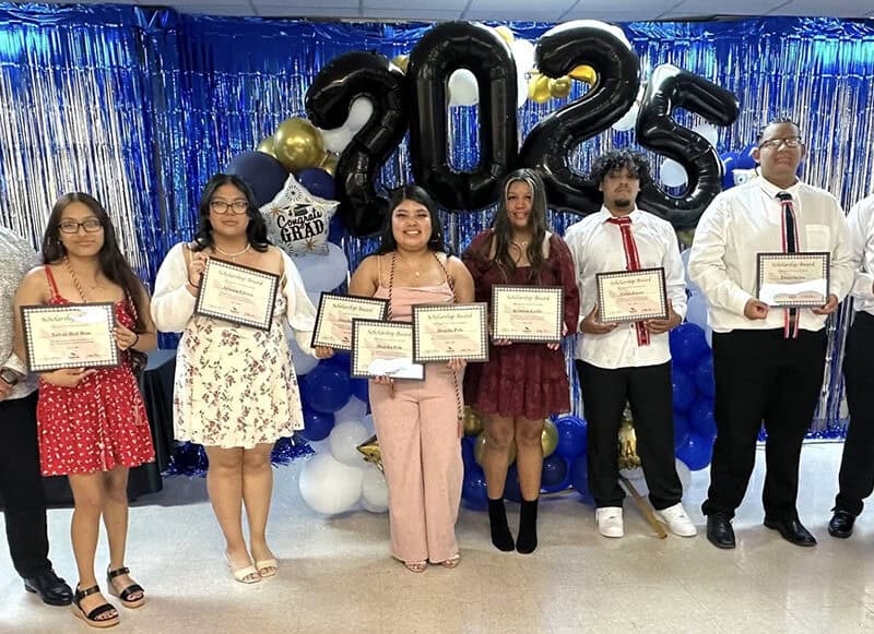 A group of people pose for a photo.