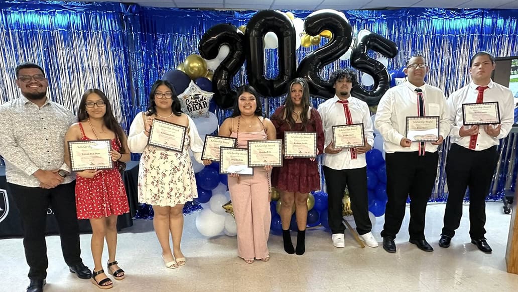 A group of people pose for a photo.