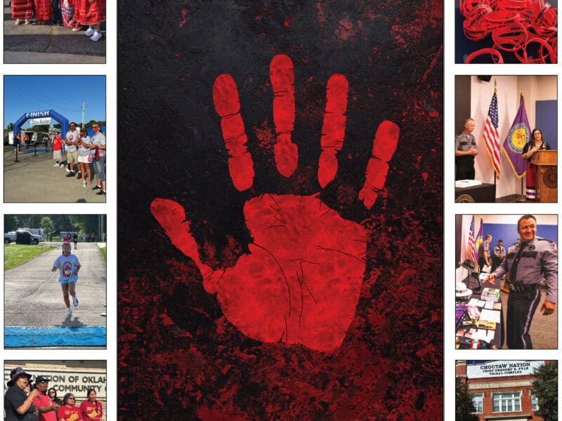 A red hand print with the text no more stolen sisters & brothers on it.