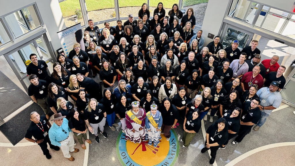 A large group of people pose for a photo.