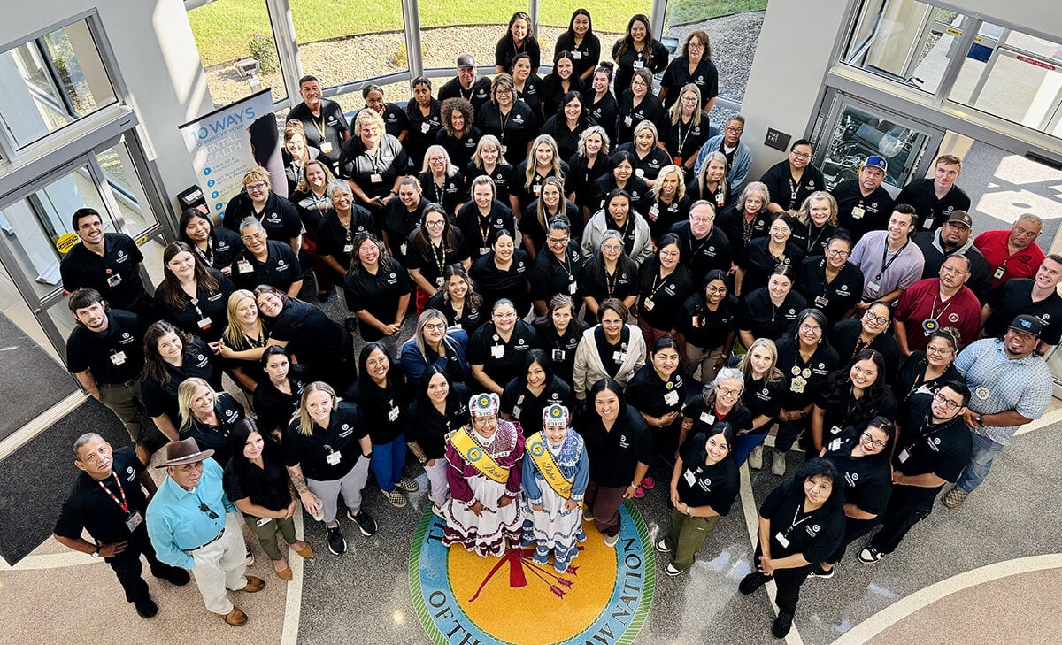 A large group of people pose for a photo.
