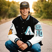 A young man poses for the camera.