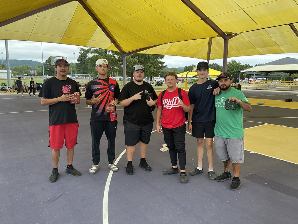 Cornhole winners pose for a photo. 