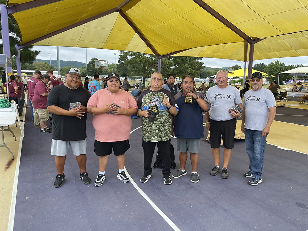 Cornhole winners pose for a photo.
