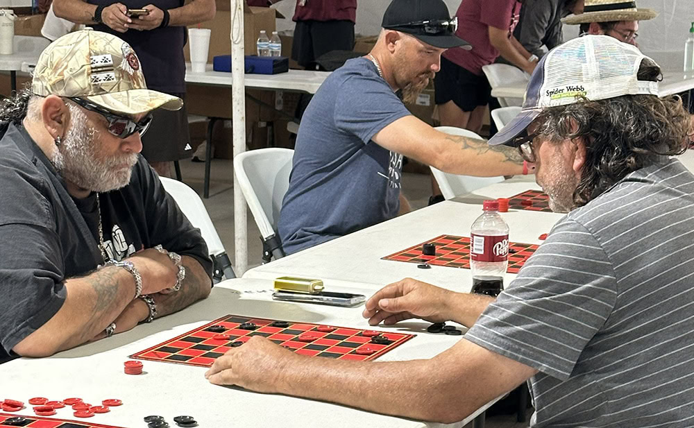 Two men play checkers