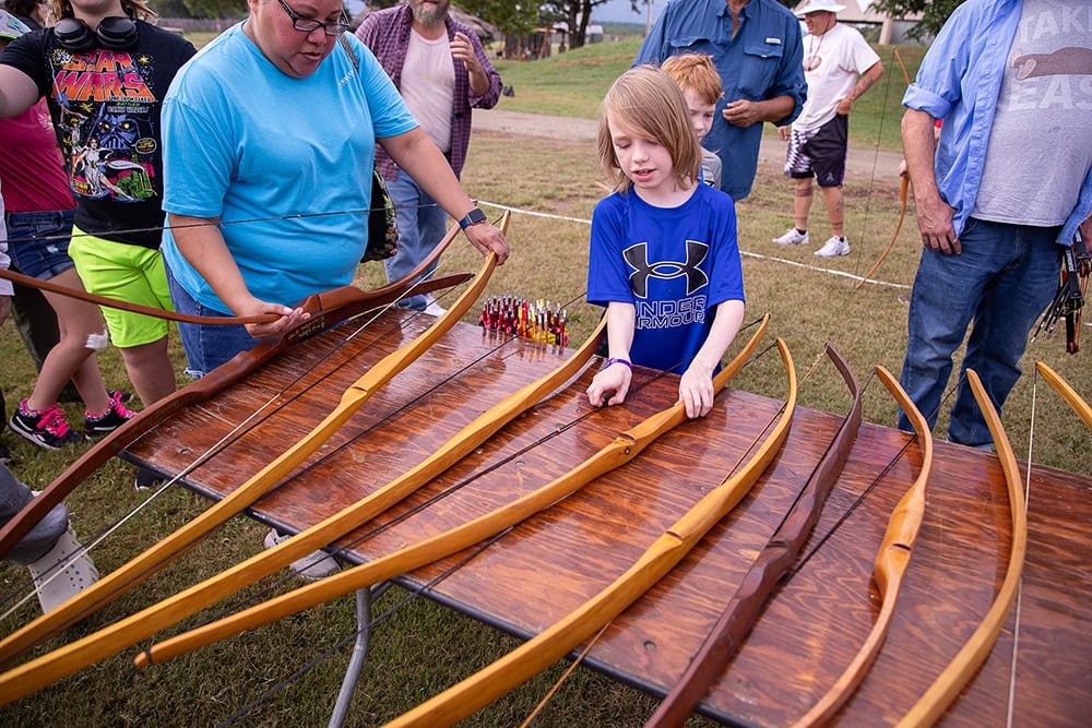A boy chooses a bow.