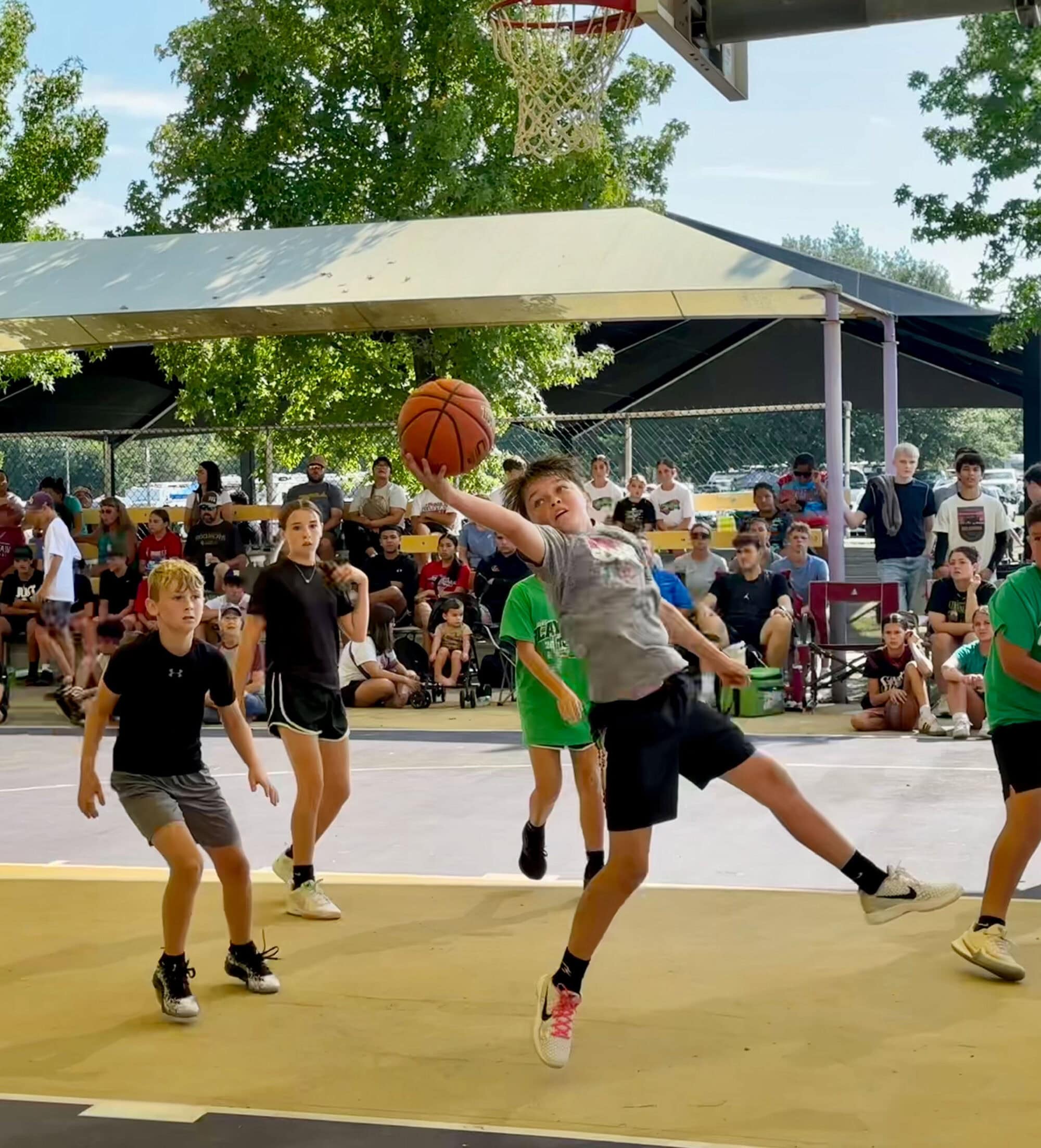 A young man rebounds the ball.
