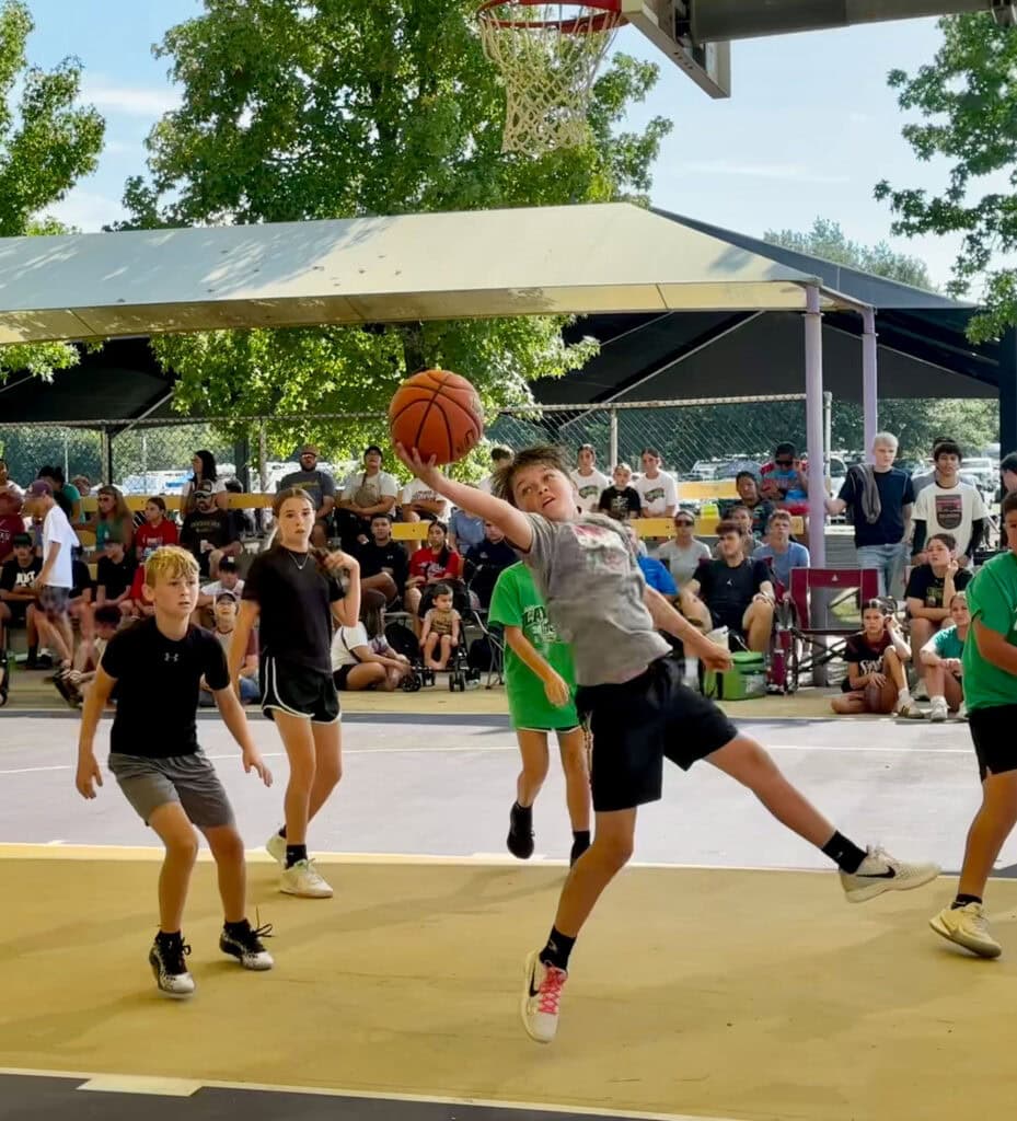 A young man rebounds the ball.