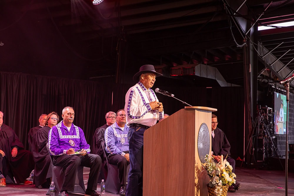 A man speaks from the podium.