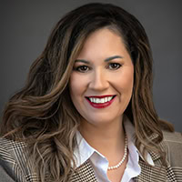 Woman smiles for the camera.