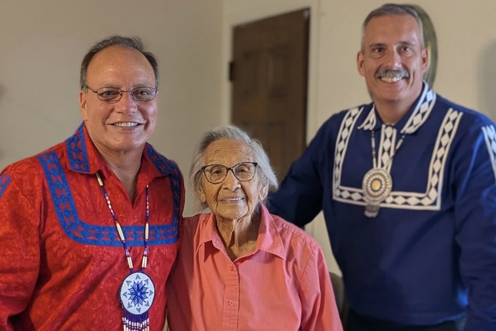 Ruby McCurry poses with chief Batton and assistant chief Austin.