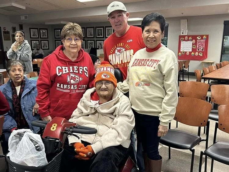 A group of people pose for a photo.