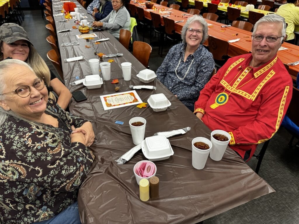 Broken Bow elders smile as they wait for their meals.