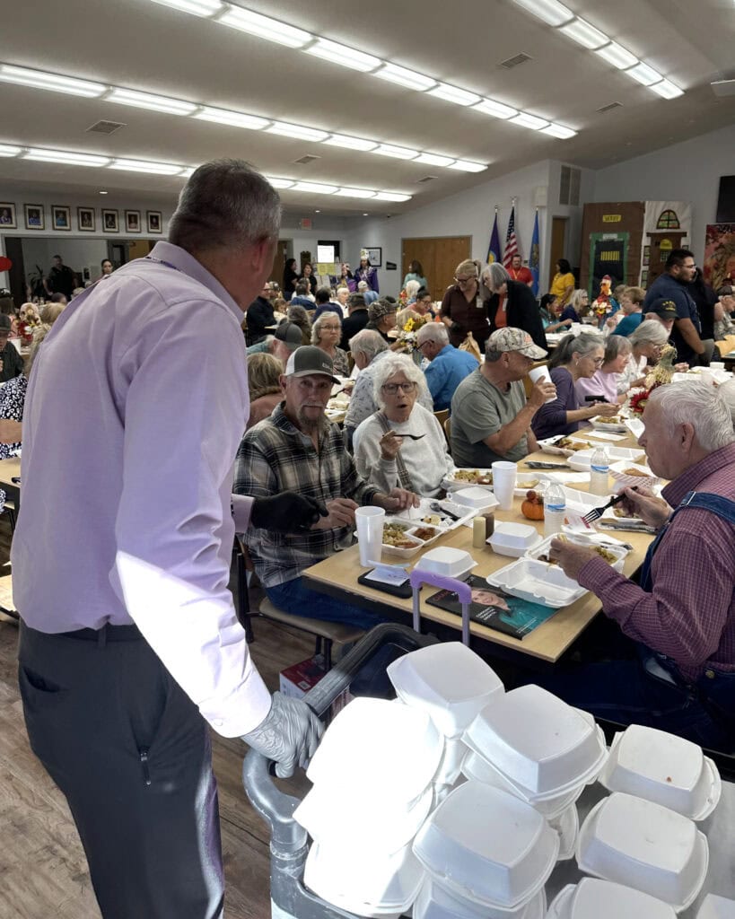 Assistant Chief hands out meals.