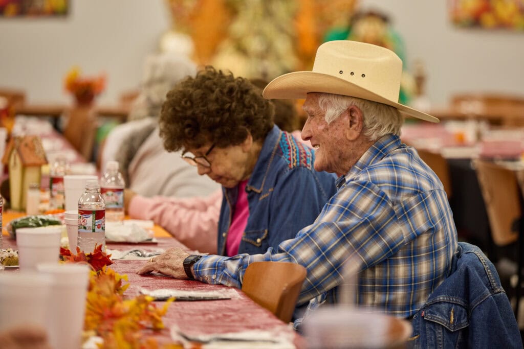 Crowder elders enjoy a meal.