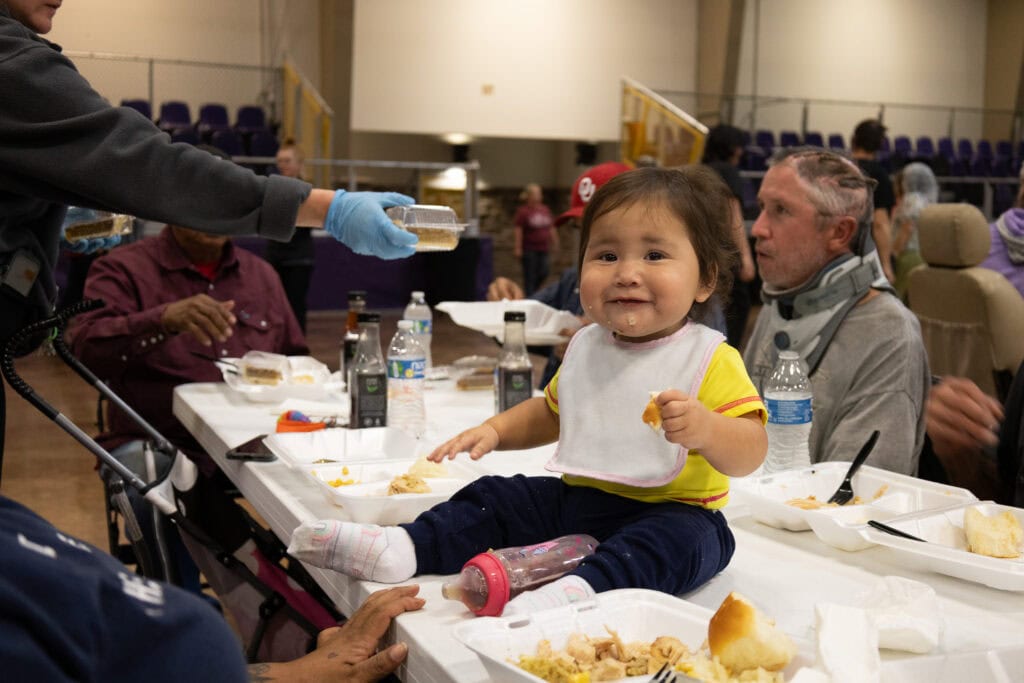 A baby sis on a table.
