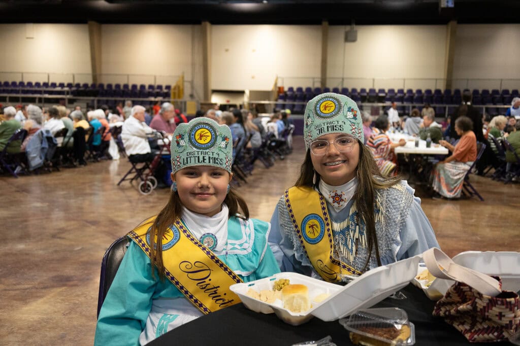 Princesses smile for a photo.