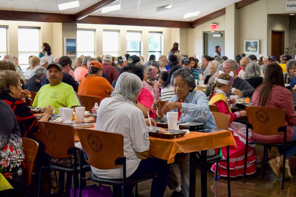 Elders enjoy a meal.