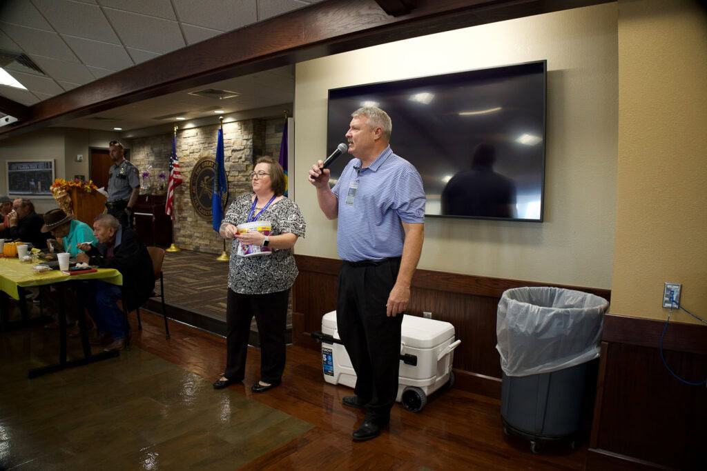 Man speaks on microphone.