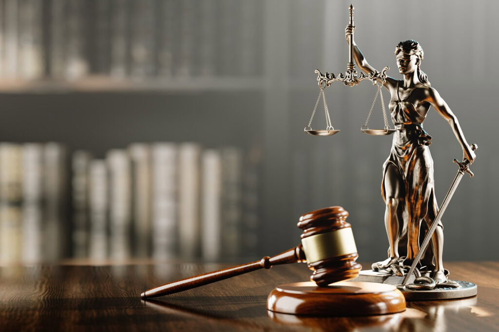 Image of a lady justice statue and a gavel.