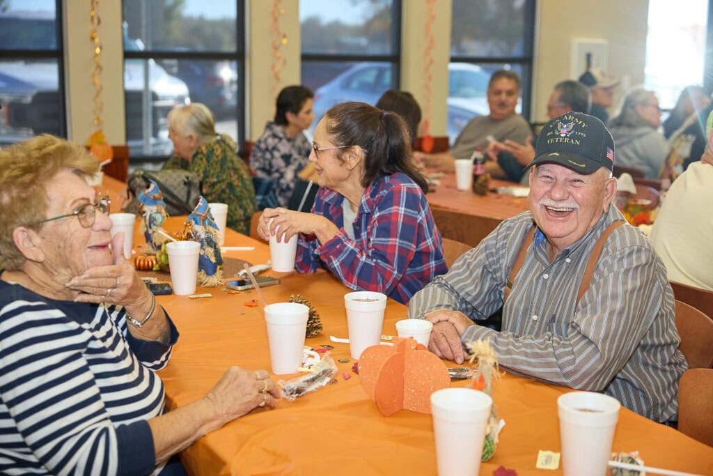Elders enjoy a meal.